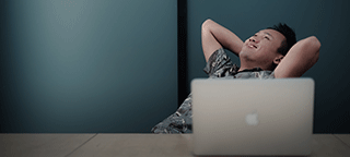 man on laptop making an online withdrawal